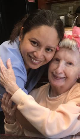 caregiver and old women smiling