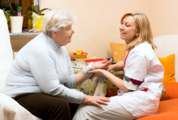 medical personnel checking up an elderly woman