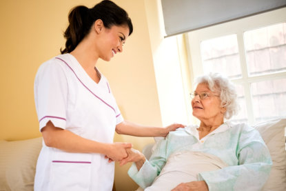 caregiver and senior patient smiling