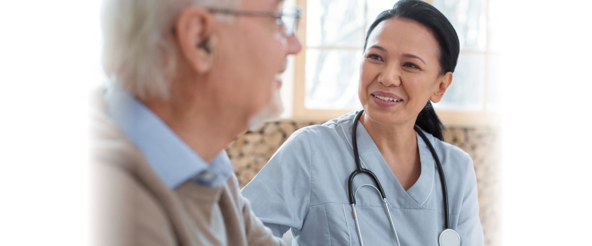 caregiver and senior man talking